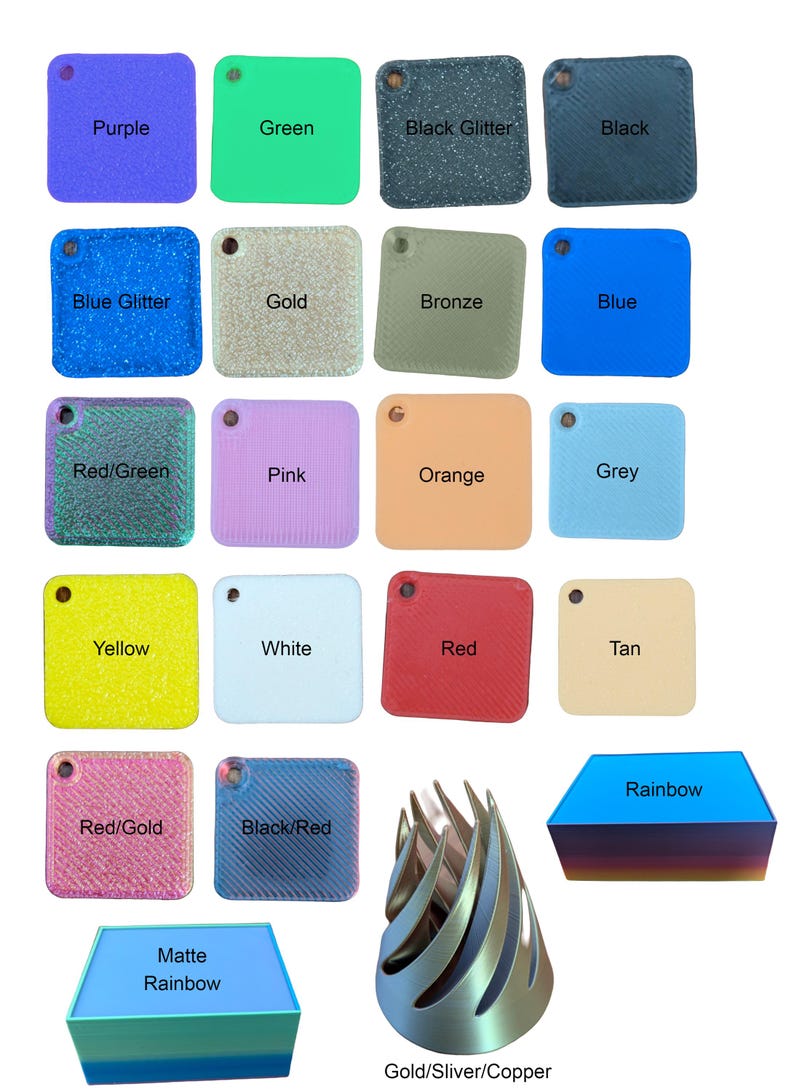 May include: A collection of 18 small square plastic tiles in various colours and finishes, including solid colours, glitter, and metallic finishes. The tiles are arranged in a grid pattern. The colours include purple, green, black glitter, black, blue glitter, gold, bronze, blue, red/green, pink, orange, grey, yellow, white, red, tan, red/gold, and black/red. There are also two additional items: a rainbow-coloured plastic tile and a silver, gold, and copper metallic tile.