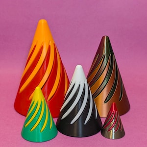 May include: Five colorful cone-shaped ornaments with a spiral pattern. The cones are red and orange, black and white, brown and green, green and yellow, and red and silver.