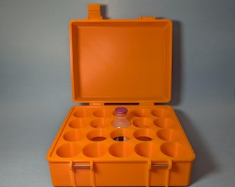 May include: Orange plastic case with 16 compartments for storing small items, such as vials or medication. The case is open and a single vial is visible in one of the compartments.