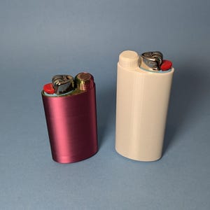May include: Two lighters, one pink and one white, with a silver top and red button.