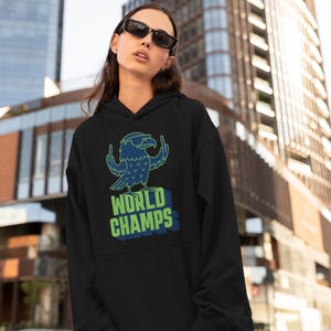 May include: A white ceramic mug with a black handle and the text "But First, Coffee" in a handwritten style. The mug is on a white surface. The mug is 4 inches tall.