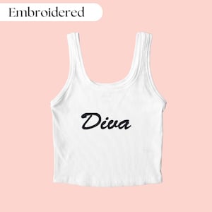 May include: White tank top with the word "Diva" embroidered in black cursive lettering.