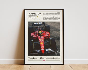 May include: A red and black Formula 1 race car with the number 44 on the side. The car is on a track and the driver is wearing a helmet. The text "HAMILTON" is at the top of the image, along with the quote "As a driver, you've always got to believe in your heart that you've got what it takes to win it. You've always got to believe in yourself. You've always got to arrive on the day and believe it can happen. You've always got to believe in the positives."