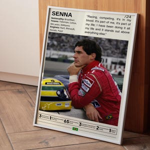 May include: A black and white photo of Ayrton Senna, a Brazilian Formula One racing driver, wearing a red racing suit and a helmet. The photo is set against a blurred background of a race track. The quote "Racing, competing, it's in my blood. It's part of me, it's part of my life; I have been doing it all my life and it stands out above everything else." is printed on the poster.