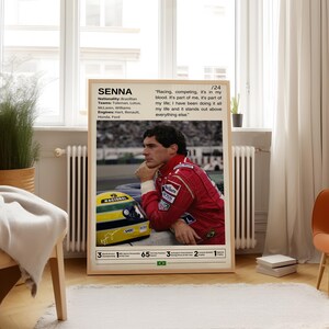 May include: A vintage-style poster featuring a black and white photo of Ayrton Senna, a famous Formula One race car driver. The poster includes Senna's name, nationality, teams, engines, and a quote from him. The quote reads, "Racing, competing, it's in my blood. It's part of me, it's part of my life; I have been doing it all my life and it stands out above everything else."