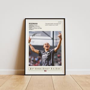 May include: A black and white poster featuring a female football player celebrating a goal. The poster includes the player's name, RODMAN, and the quote "The game doesn't care about your name; it respects your hustle." The poster also details the player's position, nationality, height, team, and number.