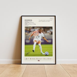 May include: A black and white poster featuring a photograph of a female football player wearing a white jersey with the number 5. The player is kicking a football. The poster includes the text "RODMAN" and "The game doesn't care about your name; it respects your hustle".