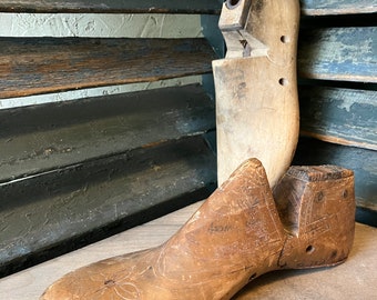 Two antique wooden shoe forms