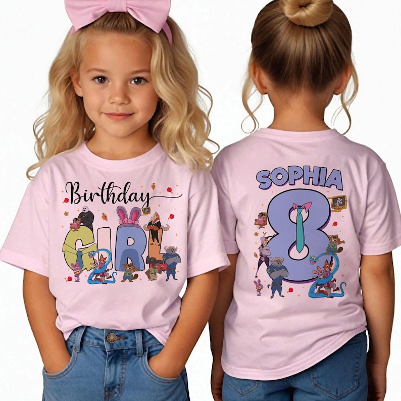May include: Pink short-sleeved t-shirts with the text "Birthday Girl" and "Sophia 8" printed on them. The front of the shirt has a colorful graphic with cartoon characters. The back of the shirt has the name "Sophia" and the number "8".