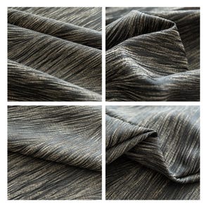 May include: Close-up of four sections of fabric. The fabric is a dark gray with a textured, striated pattern in a lighter gray. The fabric is folded and draped, showing the texture and sheen.