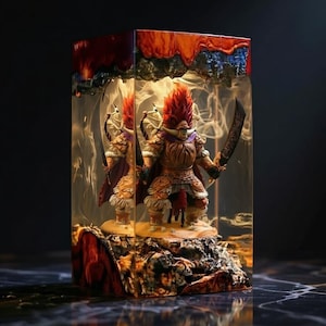 May include: A detailed figurine of a warrior with a red mohawk and a sword, encased in a clear resin block. The resin features fiery orange and blue accents, creating a dramatic, artistic display. The warrior is standing on a rocky base.