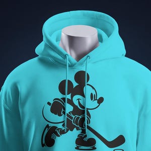 Ice hockey-themed design featuring Mickey Mouse with hockey player silhouettes and clipart. Includes SVG and PNG files, perfect for crafting, t-shirts, and sports-themed decorations. Ideal for Disney fans creating fun, hockey-inspired projects.