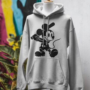 Mickey Mouse-themed baseball design featuring Mickey silhouettes and baseball clipart. Includes SVG and PNG files, perfect for crafting, t-shirts, and sports-themed decorations. Ideal for Disney fans creating fun, baseball-inspired projects.
