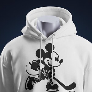 Ice hockey-themed design featuring Mickey Mouse with hockey player silhouettes and clipart. Includes SVG and PNG files, perfect for crafting, t-shirts, and sports-themed decorations. Ideal for Disney fans creating fun, hockey-inspired projects.