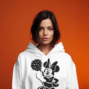 Minnie Mouse-themed cheerleading design featuring pom-poms and cheerleader silhouettes. Includes PNG and SVG files, perfect for crafting, t-shirts, and cheer mom-themed decorations. Ideal for fans of Minnie Mouse and cheerleading projects.