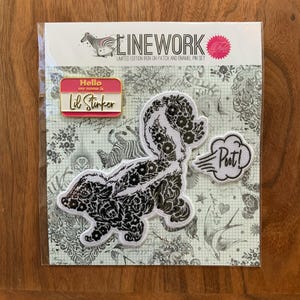 May include: A limited edition Linework iron-on patch and enamel pin set. The set includes a skunk patch with floral detailing, a "Poot!" patch, and a "Hello my name is Lil Stinker" pin, all on a patterned background.