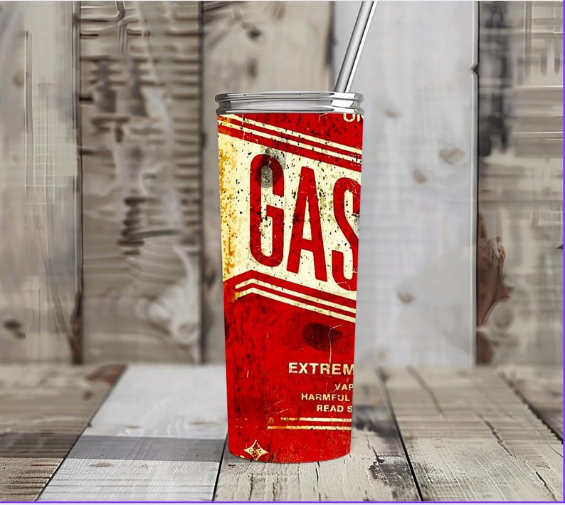 May include: A red and white stainless steel tumbler with a vintage gas can design. The tumbler has the word "GAS" in large white letters and the text "EXTREMELY FLAMMABLE VAPORS HARMFUL OR FATAL IF SWALLOWED READ CAREFULLY" in smaller white letters.