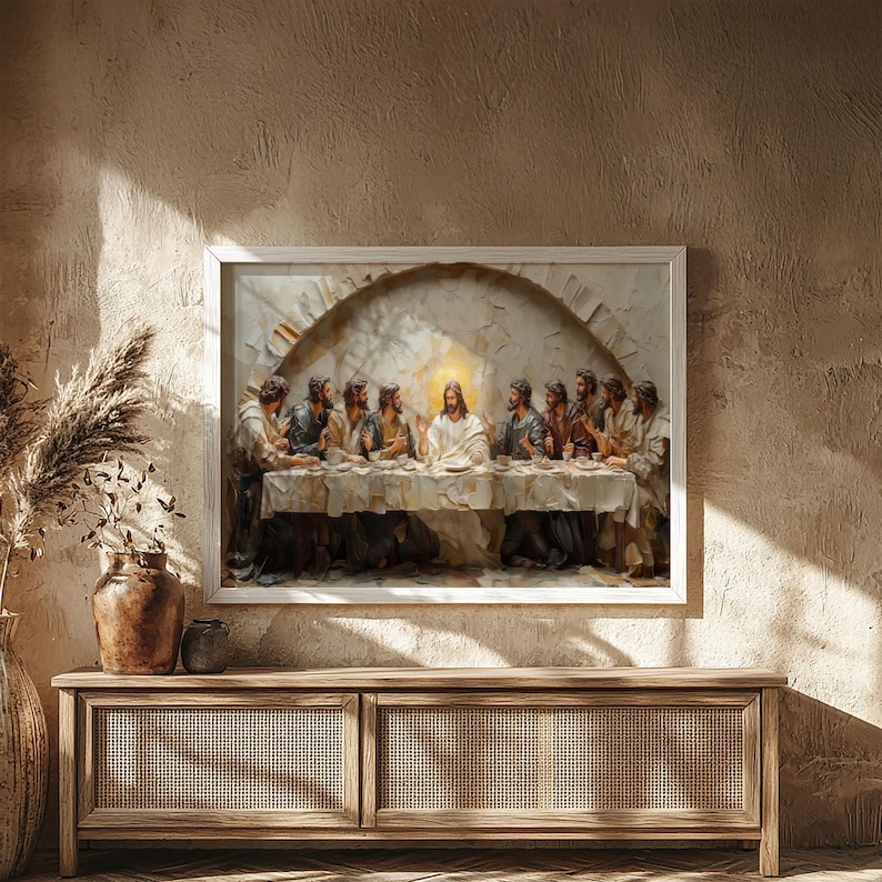 May include: A framed artwork depicting the Last Supper, featuring Jesus and his disciples seated at a table. The painting has a textured, three-dimensional effect, with a warm color palette. The artwork is displayed above a wooden cabinet.