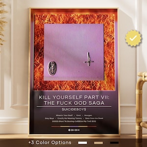 May include: Framed poster with the text "KILL YOURSELF PART VII: THE FUCK GOD SAGA" and "$UICIDEBOY$". The artwork features a purple square with three silver-colored metal objects. The background has an orange and brown textured design. The poster has a gold frame.