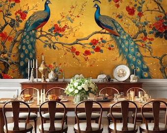 May include: A dining room with a gold and red floral wallpaper featuring two peacocks. The wallpaper has a vintage look. The room has a long wooden table with eight chairs and a white floral centerpiece.
