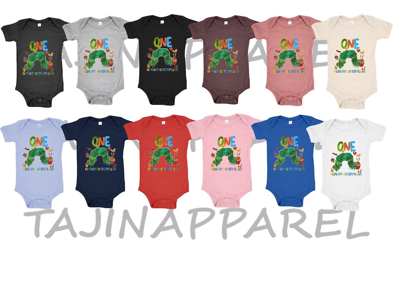 May include: A collection of baby onesies in various colors, each featuring a colorful graphic of a caterpillar and the word "ONE". The text "The Very Hungry Caterpillar" is also printed on the onesies. The brand name "TAJINAPPAREL" is printed at the bottom.