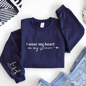 I Wear My Heart On My Sleeve Sweatshirt,  Mama Sweatshirt with Kids Name on Sleeve, Mothers Day Shirt, Personalized Mother Day Gift for Mom