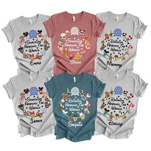 May include: Six t-shirts in various colors, each featuring a circular design with food and drink icons and the text "Snacking Around the World" or "Drinking Around the World". Names are printed below the designs.