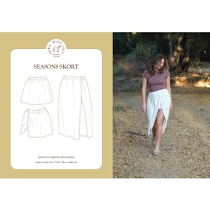 Op de afbeelding: De afbeelding toont een naaipatroon voor een rok, getiteld "SEASONS SKORT". Het patroon bevat diagrammen van het rokontwerp. Een vrouw draagt een witte rok met een hoge split. De maten van het patroon variëren van A-Z, met heupmaten van 80 cm tot 180 cm.