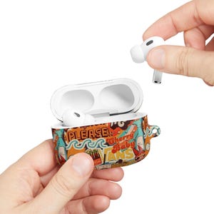 May include: A retro-themed AirPod case with a colorful design featuring the words "PLEASE!" and "Cherry Baby". The case is open, revealing a white AirPod inside, with another AirPod being held nearby.