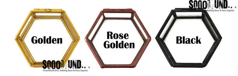 May include: Three hexagonal glass boxes with lids. The boxes are in gold, rose gold, and black.