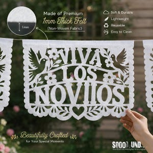 May include: A white felt banner featuring intricate laser-cut designs of birds, flowers, and a heart, with the text VIVA LOS NOVIOS. The non-woven fabric is 1mm thick. The banner includes icons for soft, durable, lightweight, reusable, and easy to clean.