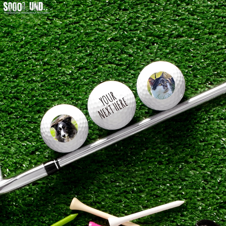 May include: Three white golf balls with personalized images. The first ball has a photo of a cat, the second ball has a photo of a dog, and the third ball has the text "YOUR NEXT HERE".