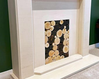 Blackened Decorative Logs: charred wood media wall alcove logs, empty fireplace filler