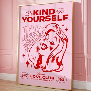 May include: Pink and red graphic print with a woman's face and the text "Be Kind To Yourself", "Hello Gorgeous", "The Self Love Club 24/7 365", and "Because You Are Worth It".