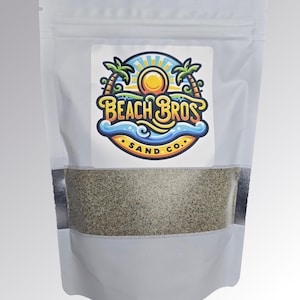 May include: A white resealable bag with a label featuring a cartoon logo of palm trees, a sun, and waves. The logo says "Beach Bros Sand Co.". The bag contains a light gray sand-like substance.