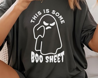 May include: Dark gray t-shirt and shorts set. The shirt features a white graphic of a ghost with the text "THIS IS SOME BOO SHEET". The shorts are a matching dark gray color.