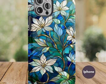 May include: A phone case with a stained-glass floral design. The case features white flowers, green leaves, and gold accents against a blue background. The word "iPhone" is printed on the case.