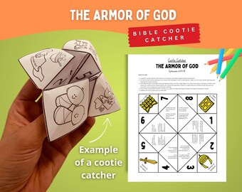 May include: A white paper cootie catcher with black line drawings and text, held in a hand. The text on the cootie catcher reads "The Armor of God." A printed sheet with instructions and colored pencils are also visible.
