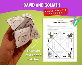 May include: A white paper cootie catcher with black line drawings of Bible characters and the text "David and Goliath." The image includes a printed instruction sheet and colored pencils, all set against a green background.