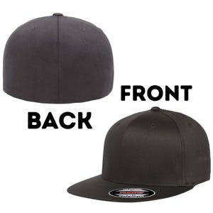 May include: Two views of a charcoal grey baseball cap. The back of the cap is shown on the left, and the front with the brim is on the right. The word "FRONT" is above the front view, and "BACK" is above the back view.