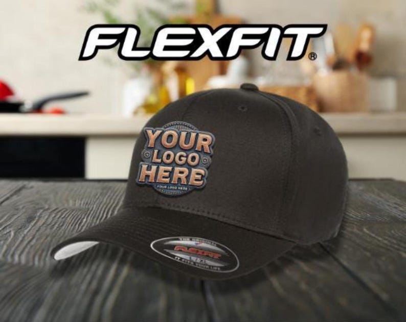 May include: A black Flexfit baseball cap with a brown patch that says "YOUR LOGO HERE".