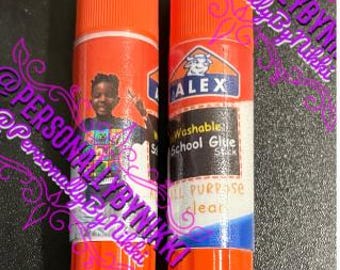 May include: Two orange and white glue sticks. One stick features a child and the word "School". The other stick has the brand name "ALEX", and the words "Washable School Glue Stick" and "All Purpose Clear".