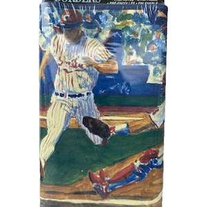 May include: A package of decorative wallpaper border featuring a baseball scene with a player sliding into home plate. The border is 9 inches by 5 yards and is prepasted and strippable. The package is labeled "Decorative Borders" and "Fashion Point".