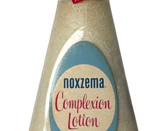 Botella vintage de Noxzema de los años 50: vidrio transparente con relieve y etiqueta original.