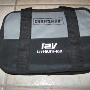 May include: Black and gray tool bag with the text "CRAFTSMAN" and "12V LITHIUM-Ion" printed on it.