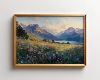 May include: A framed landscape painting with a gold-colored frame. The artwork depicts a mountain range, a lake, and a field of wildflowers in shades of purple, yellow, and green. The sky is a mix of blue and white.