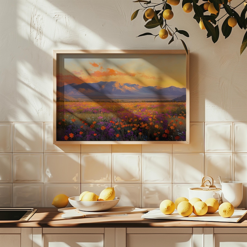 May include: A framed landscape painting depicts a field of colorful wildflowers under a sunset sky. The artwork features a wooden frame and is displayed on a tiled wall. The scene includes mountains and a vibrant display of orange, purple, and yellow flowers.