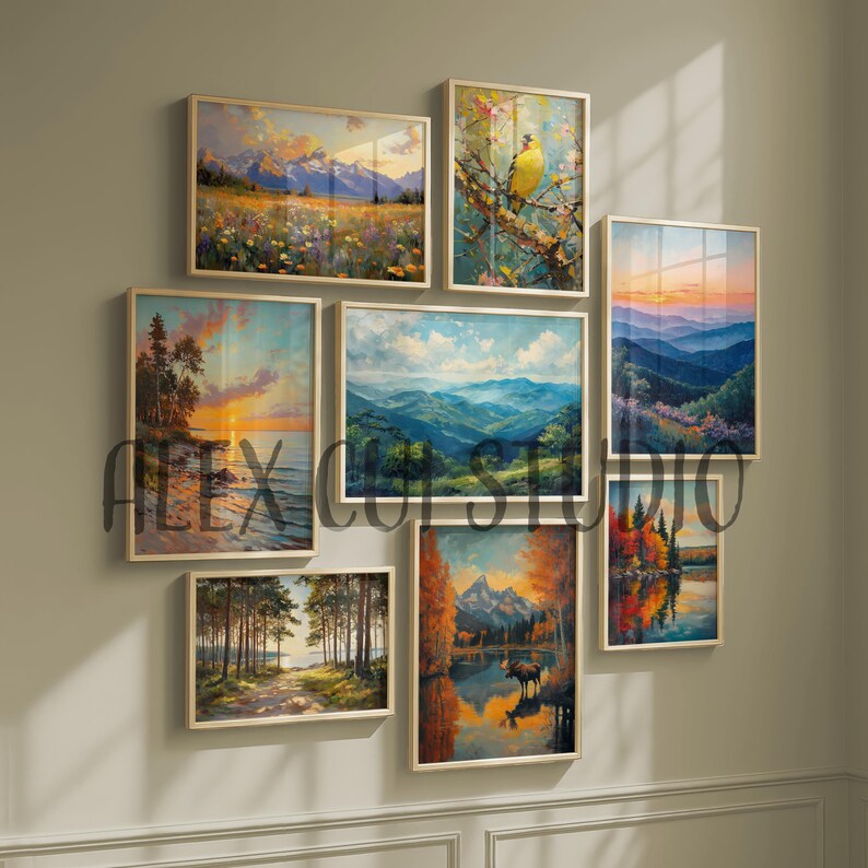 May include: A collection of framed landscape art prints. The artwork features scenes of nature, including mountains, forests, and bodies of water. The color palette includes blues, greens, oranges, and yellows. The frames are a light wood color. The text "ALEX CU STUDIO" is visible.