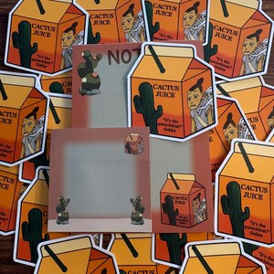 May include: A collection of orange cactus juice carton stickers and square memo pads. Each sticker features a cartoon character, a green cactus, a black straw, and the text Cactus Juice It's the quenchiest! -Sokka. The memo pads feature a cactus.