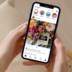 May include: A smartphone displaying an Instagram post announcing a pregnancy with a sonogram image and the text "WE'RE EXPECTING! Baby Stevenson - December 2023". The post is accompanied by a bouquet of colourful flowers.